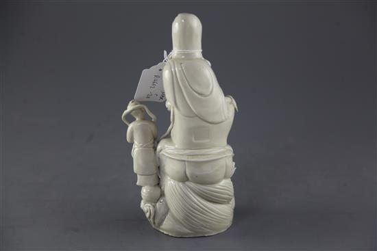 A Chinese Dehua blanc de chine group of Guanyin and an attendant, 24.5cm, slight restorations